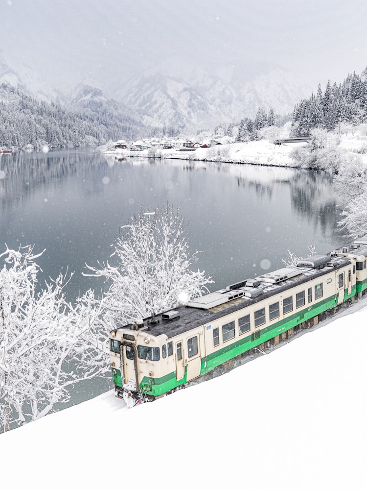 [Image1]The Tadami Line runs through the village of Taishi in winter.