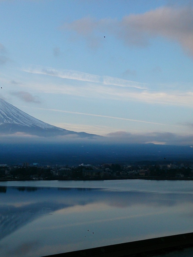 [Image1]This is a photo of my wife and I staying at a ryokan on the shore of Lake Kawaguchi.Mt. Fuji seen fr