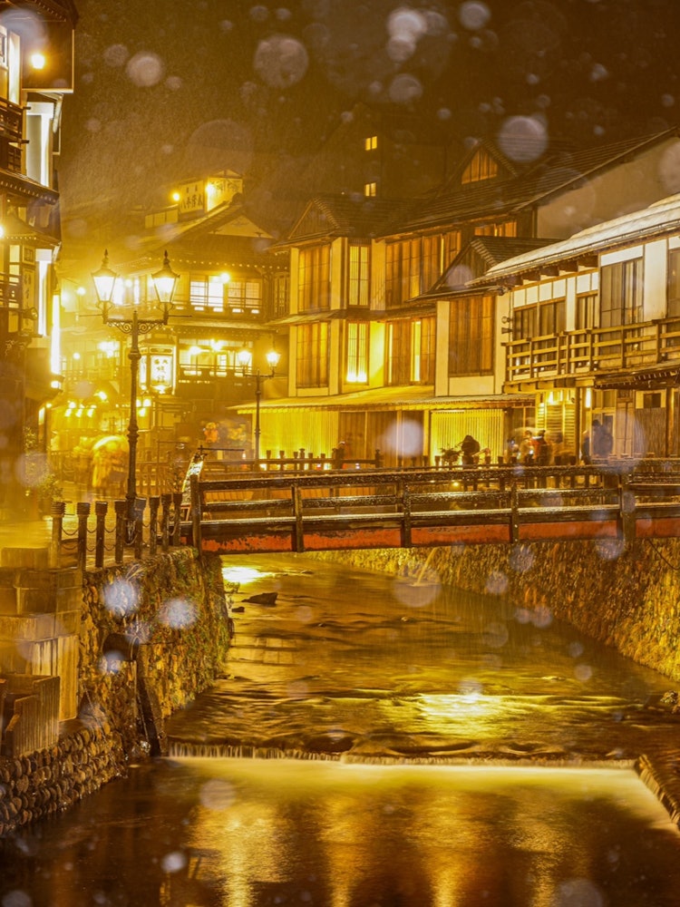[Image1]Snowy scenery of Ginzan Hot Spring.The shining cityscape is beautiful.