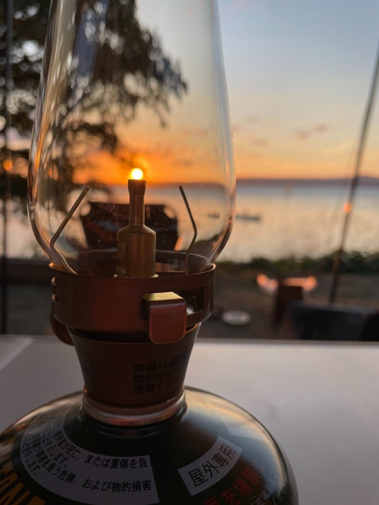 [Image1]Fall camp. The sunset was very beautiful, so I took a picture of the sunset with the lantern in fron