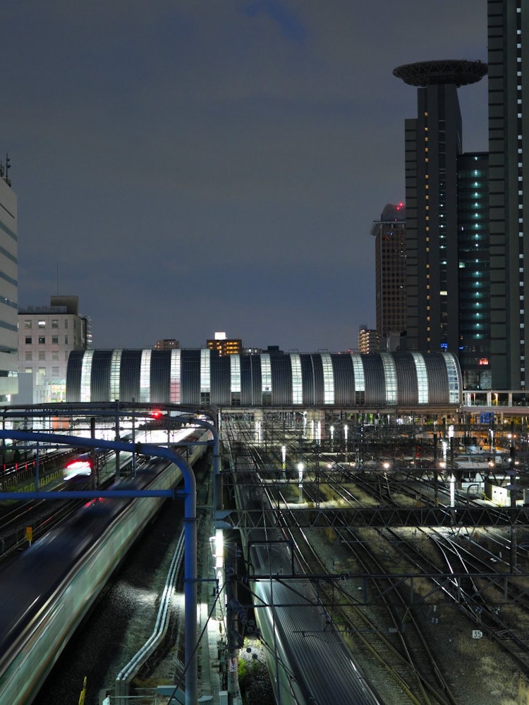 [Image1]View of Saitama Shintoshin Station from the bridgeThe futuristic station building shines at night