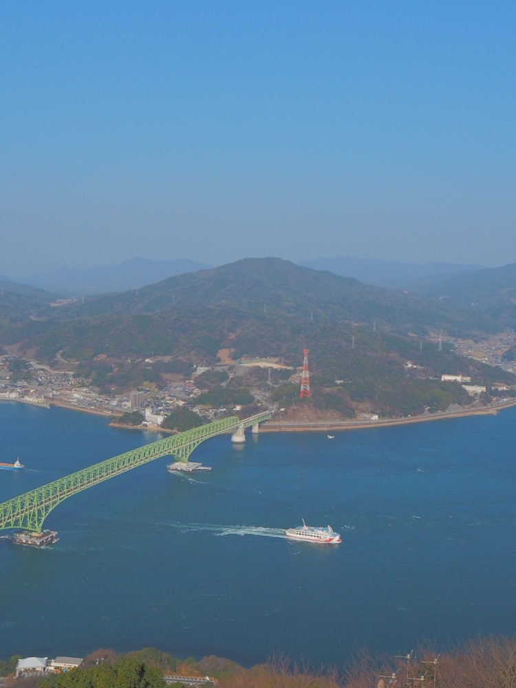 [Image1]View from the Iinoyama Observatory on Suo Oshima, Yamaguchi Prefecture. A ferry bound for Matsuyama 